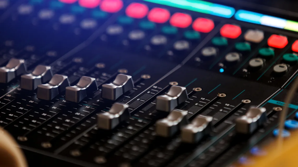 Mixer panel with volume faders pushed high
