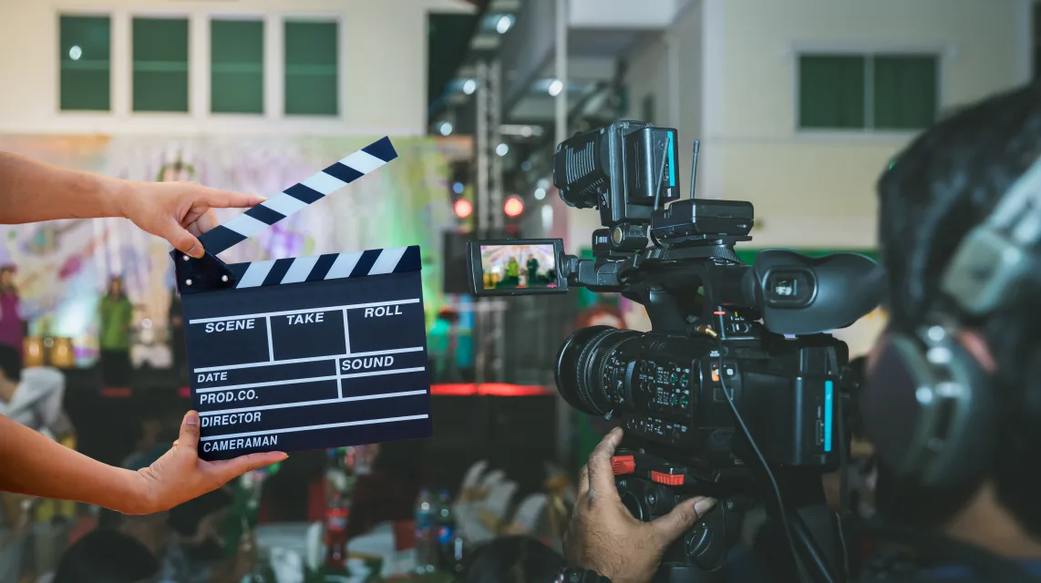 Film crew operating a camera on a music video set